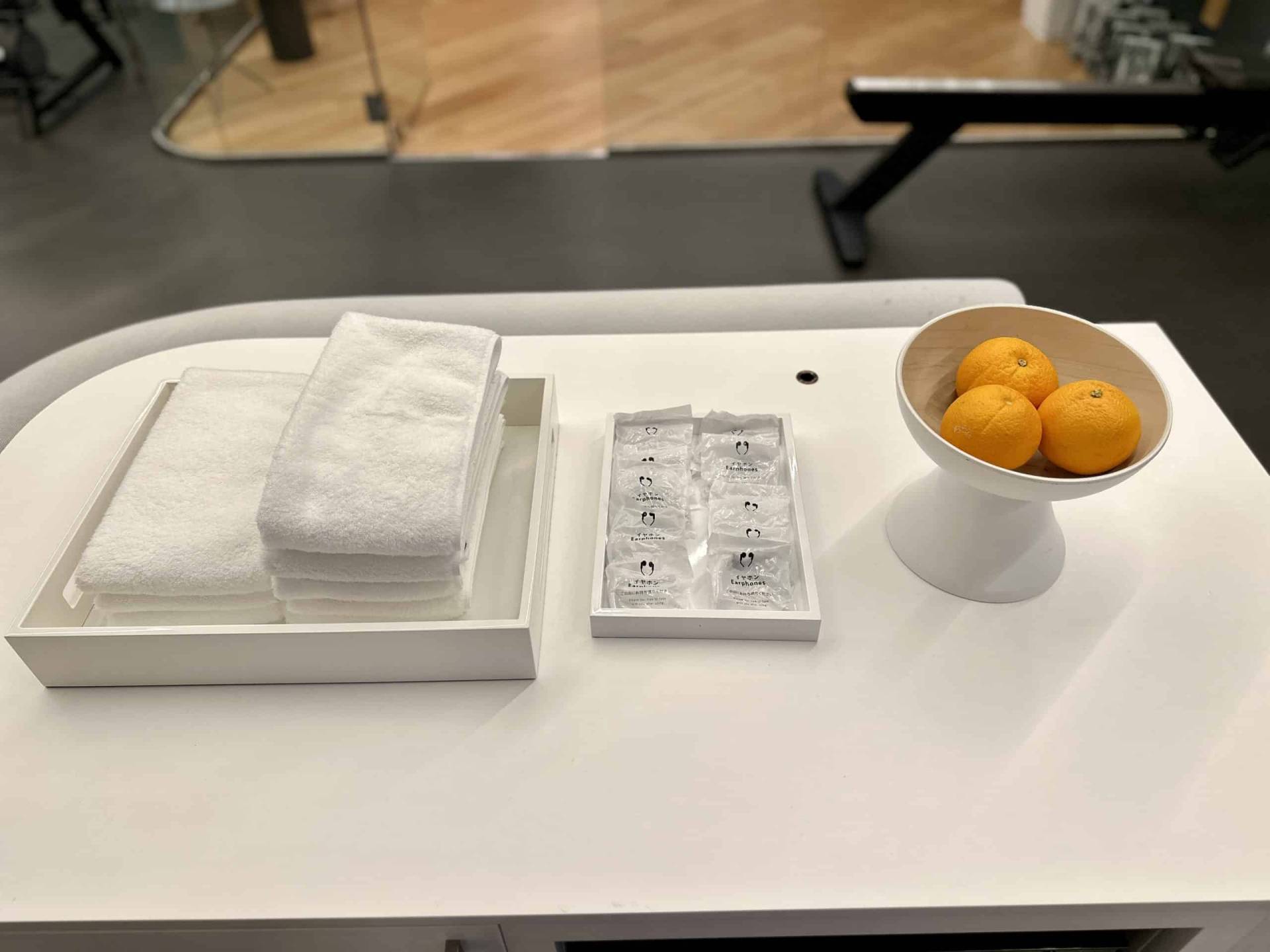 Complimentary towels,earphones, and oranges inside of the FIT Gym complimentary-towels-earphones-oranges-fit-gym