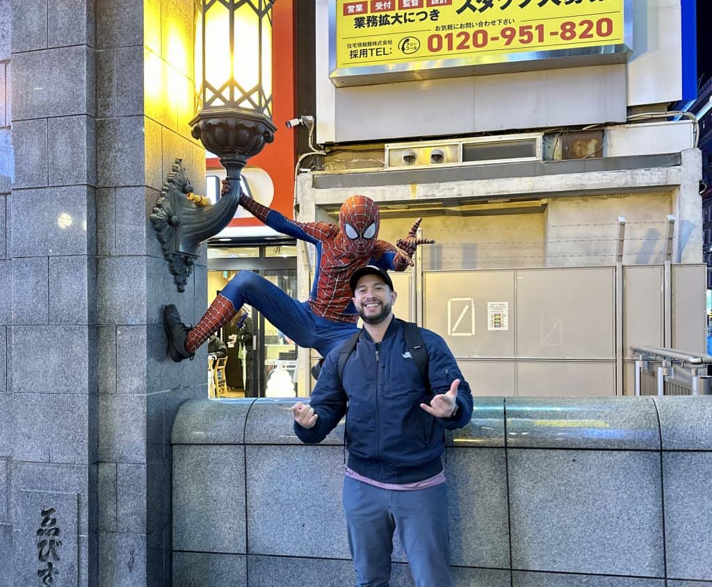 Posing with Spiderman in Dotonbori District. Osaka, Japan.